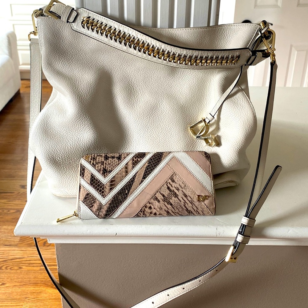 Diane Von Furstenburg white leather shoulder bag & zipper wallet.Good condition.